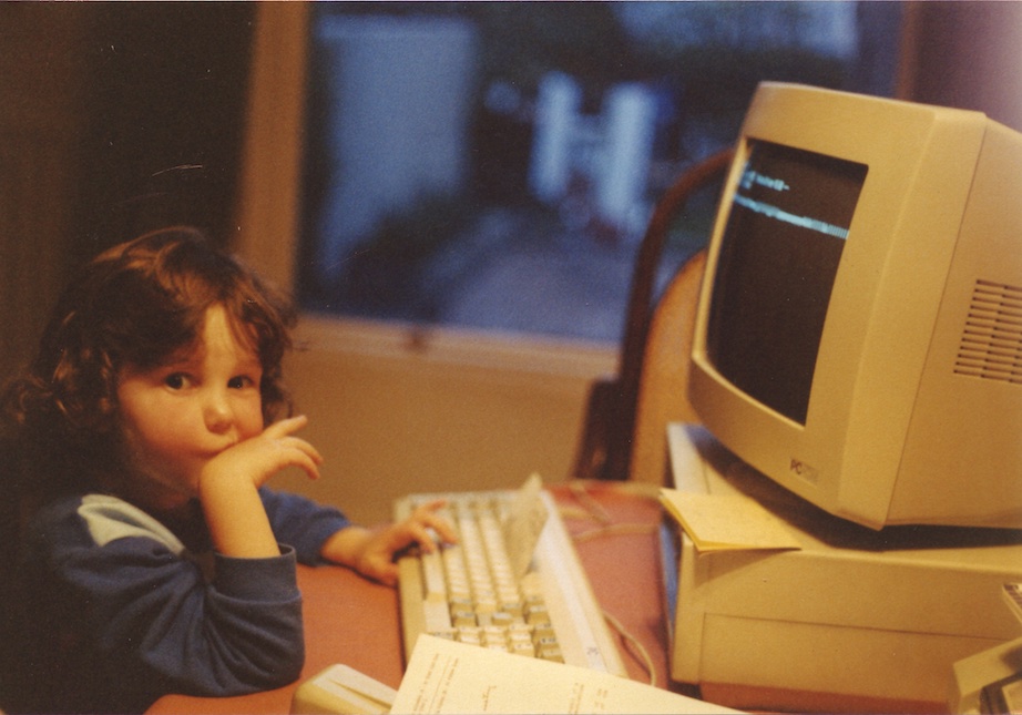Jade Masterson Hally working on her computer, age 5